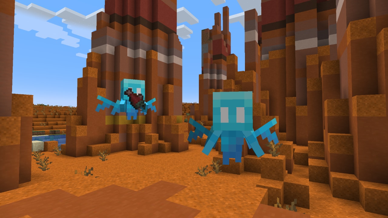 Two allay mobs carrying an item in a badlands biome