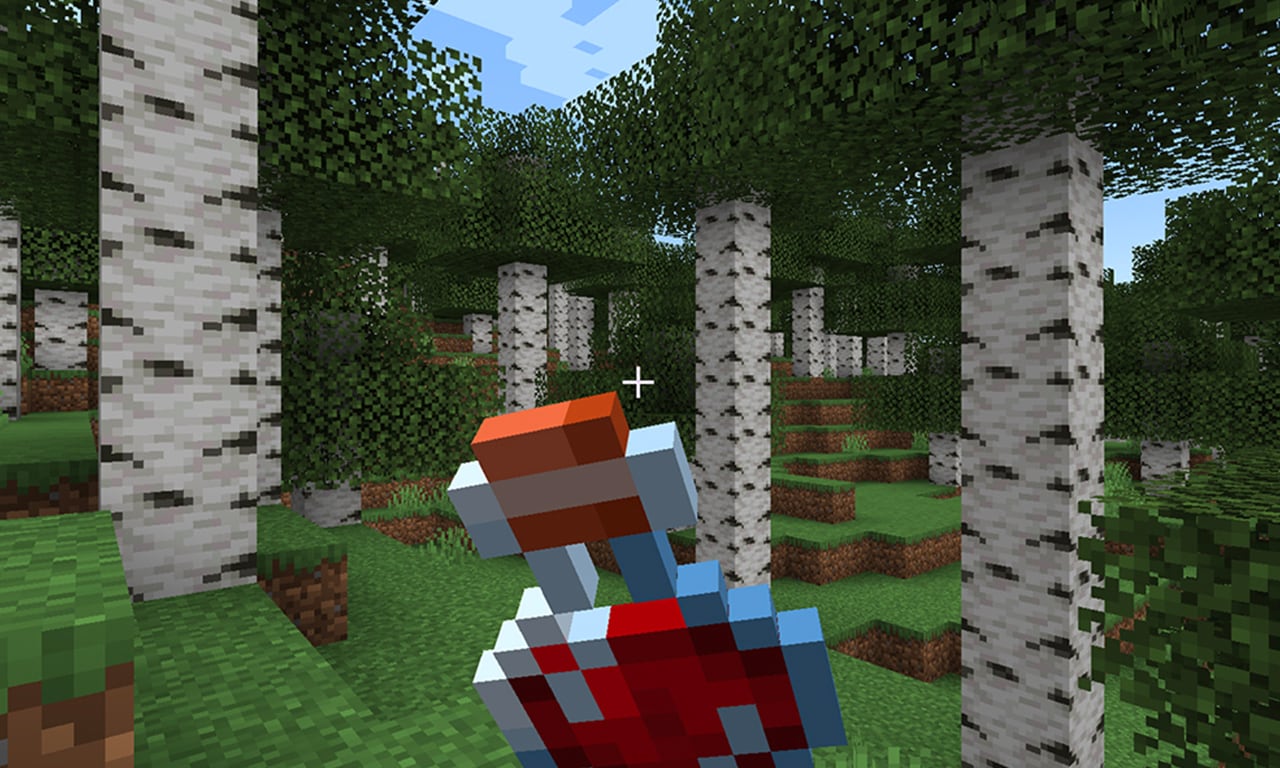 A healing potion is being held by a player in the middle of a birch tree forest