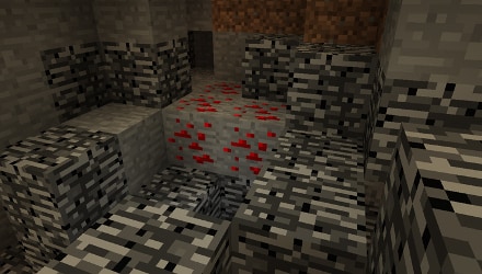 A Minecraft cave with redstone blocks